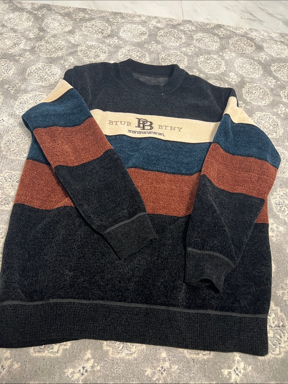 Striped Crewneck Sweater in Black, Rust & Blue with Logo Detail